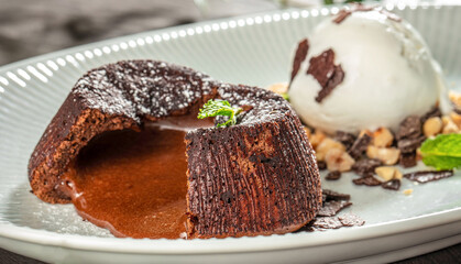 Warm chocolate lava cake with a rich molten center served with vanilla ice cream, nuts and chocolate flakes, gourmet dessert menu, branding and premium food