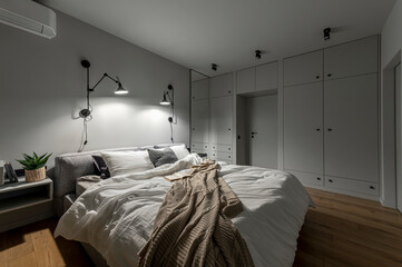 Cozy bedroom with modern design and soft lighting