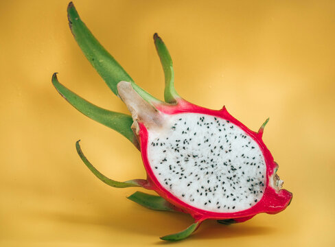 Dragon fruit with vibrant yellow backdrop display