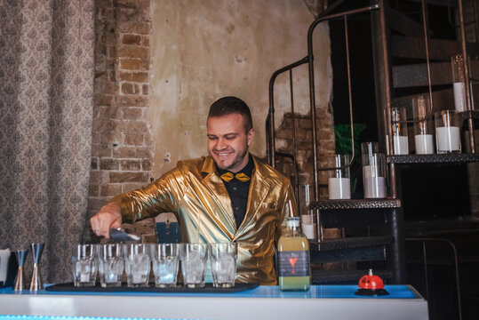 Bartender crafting elegant cocktail beverages
