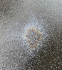 Closeup Stains of gasoline on asphalt