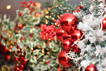 Christmas and New Year background. Christmas tree decorated with red balls and garlands