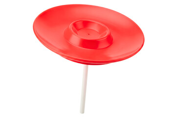 Red plastic juggling spinning plate balanced on white plastic stick isolated on a transparent background