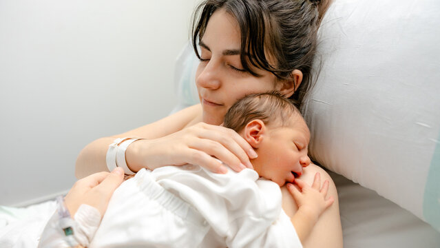 Newborn resting peacefully with mother in hospital