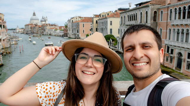 Couple taking selfie on Ponte dell'Accademia in Venice