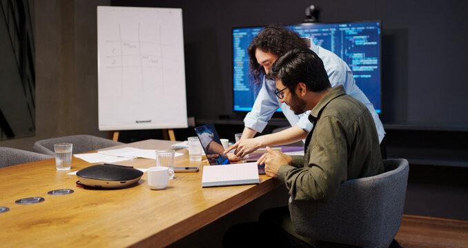 design review session, collaborative team deeply analyzing user interface designs and solutions