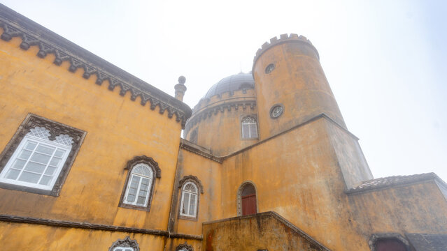 Pena Palace vibrant facade in misty Sintra landscape