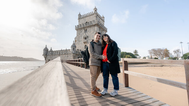 Couple in Lisbon with Torre de Belem in the background