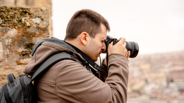 Man photographing Lisbon from Sao Jorge Castle