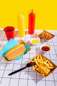 Delicious hot dog meal with fries and condiments