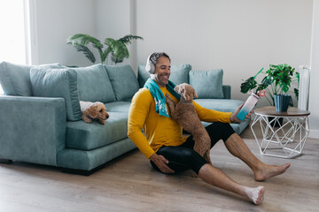 Man training at home with a dog companion