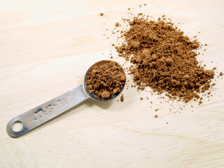 Cocoa powder and measuring spoon