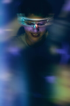 Boy Wearing Neon LED Cyber Glasses in Motion