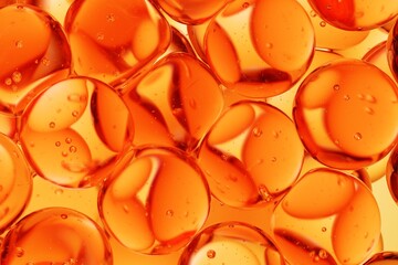 Close-up of translucent orange spheres immersed in liquid with visible air bubbles, designed for cosmetic science visuals, skincare ads, and clean abstract backgrounds