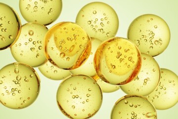 Golden translucent spheres with suspended micro air bubbles, forming a refined abstract composition suitable for wellness advertising, beauty product showcases, and futuristic design concepts