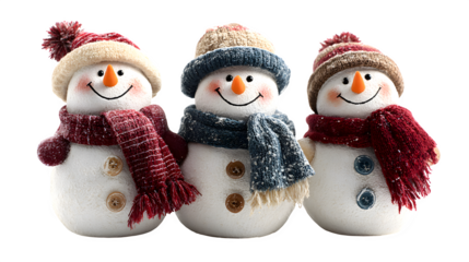 Trio of smiling snowmen wearing scarves and hats isolated on white background