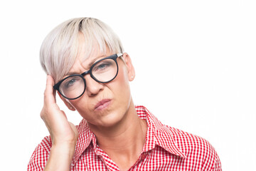 Tired woman looking at camera, isolated on white background. Exhausted middle aged woman with sleepy expression.