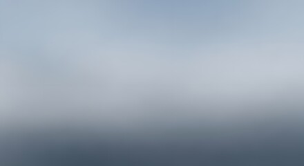 Obraz premium Misty horizon over a calm blue body of water