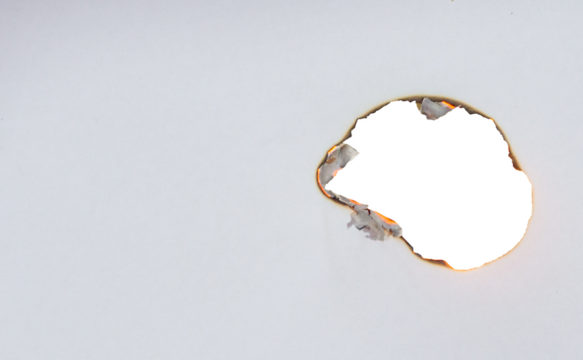 Burnt Torn White Paper Holes with Scorched Edges on Transparent Background for Frame Design or Creative Project.