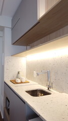 Small Kitchen in light colors. Cozy studio apartment