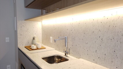 Small Kitchen in light colors. Cozy studio apartment