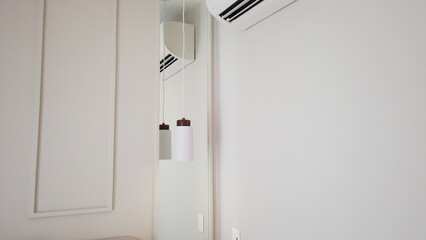 Cozy Bedroom with Pendant Lighting and Boiserie Details. Interior Design