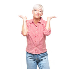 Clueless adult woman being in confusion with stretched arms opened palms, isolated on white background.