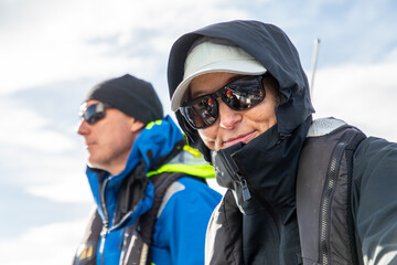 Couple sailing adventure in the scenic waters of Norway