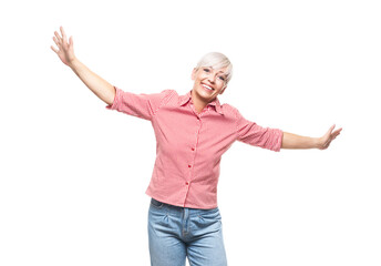 Adult woman flying or celebrating with stretched arms, isolated on white background. Carefree middle aged woman with open arms, freedom concept.