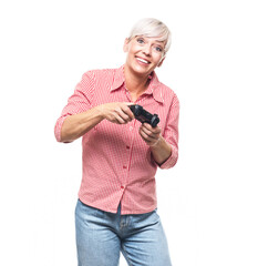 Amazed woman playing video games with joystick, isolated on white background. Front view of surprised middle aged woman holding controller and looking at camera.