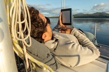 Relaxed man enjoying a boat ride in Norway