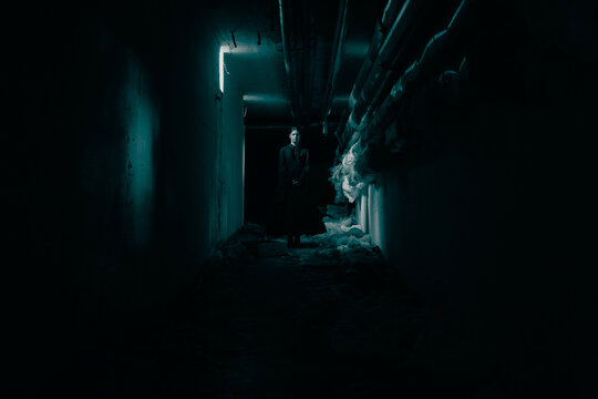 Horror scene of spooky female ghost in black dress