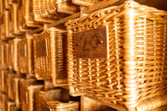 Woven baskets with numbered wooden plaques