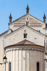 Verona Cathedral's impressive facade against a clear blue sky.