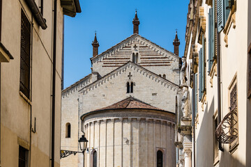 Verona Cathedral's impressive facade against a clear blue sky.
