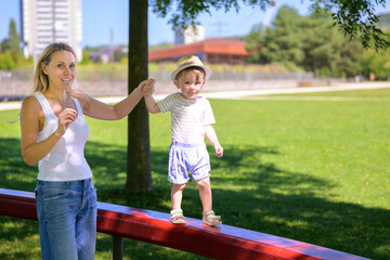 Mother Guiding Toddler Outdoors