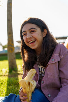 Young chilean girl smiling while enjoying her day outdoors