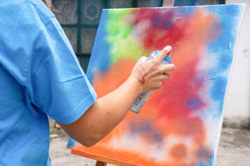 Artistic workshop featuring vibrant spray painting