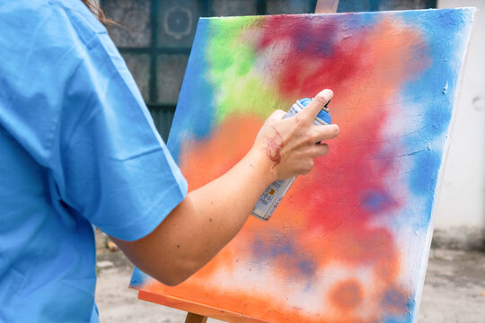 Artistic workshop featuring vibrant spray painting