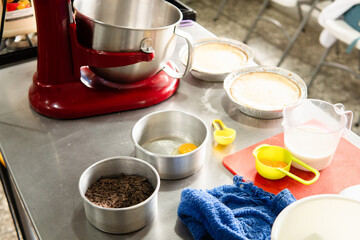 Preparing sweet desserts with baking ingredients on kitchen counter