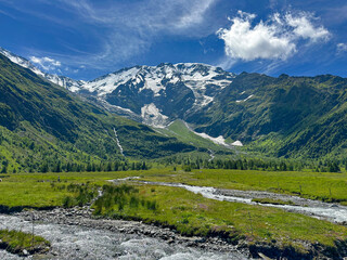 mountain landscape with a stream on a summer day 