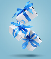 Gift boxes falling on pale blue background. Present