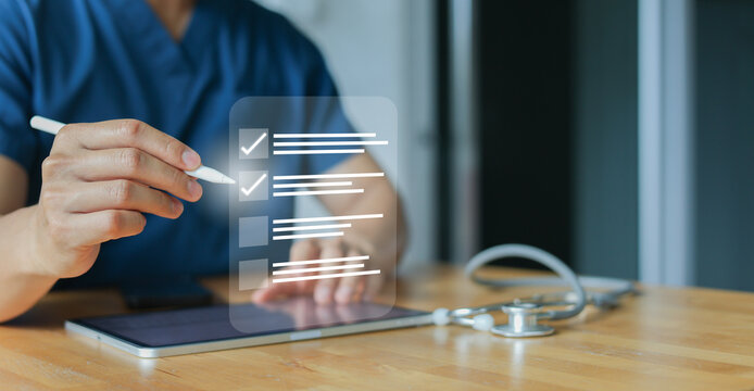 close up young general practitioner hand use stylus pen to check box on medical chekclist or opd record to read and diagnose and assess about patient's symptom for healthy and lifestyle concept