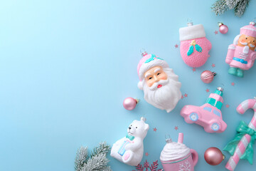 Cute pastel Christmas ornaments on light blue background. Flat lay, top view.