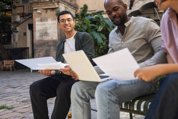 Coworking team collaborating in outdoor office space