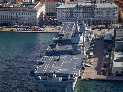 Aerial view of the Italian Navy's aircraft carrier Cavour at dock near Piazza Unit&agrave; d'Italia, the city's main square, Trieste, Italy.