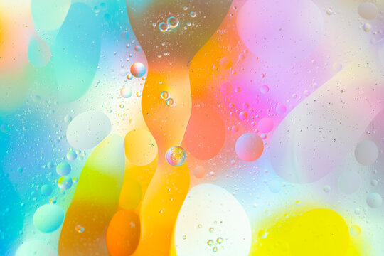 Abstract spheres in vibrant and colorful liquid dance