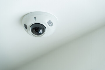 Ceiling security camera in modern house interior