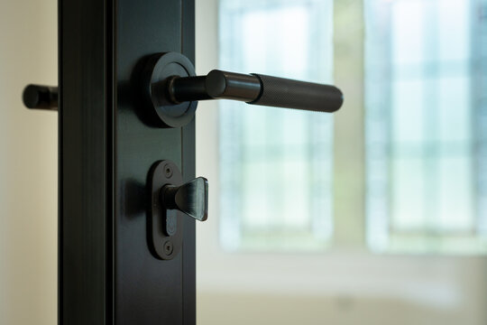 Close up of a sleek door handle in modern London home