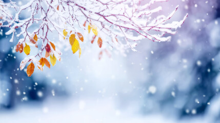 Winter branches holding last autumn leaves, vibrant colors against frozen snowy backdrop, falling snowflakes